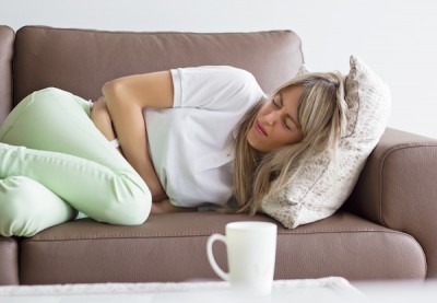 woman having stomach pain, period pain